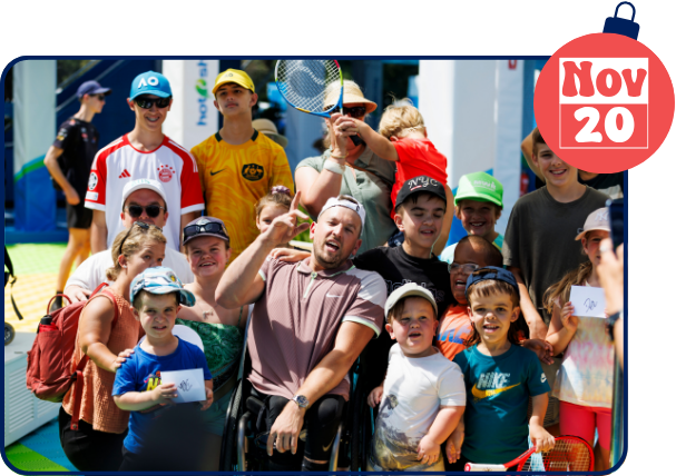 Dylan Alcott in wheelchair smiling surrounded by children at the All Abilities Day for the Australian Open Dylan Alcott in wheelchair smiling surrounded by children at the All Abilities Day for the Australian Open