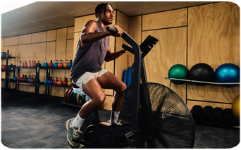 Man in a gym using an exercise machine