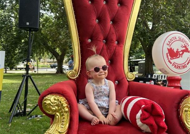 Client case study Sienna sitting on Santa's throne Client case study Sienna sitting on Santa's throne
