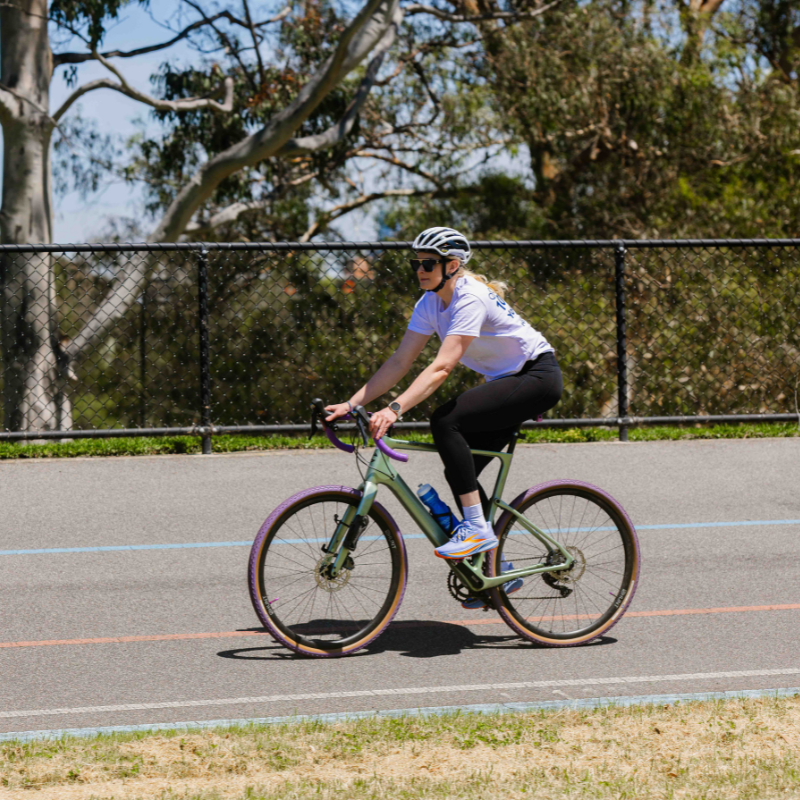 Jess Gallagher rides a bike on the vellodrome
