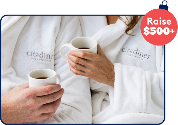 Two people holding a coffee, wearing white robes with branding 'citadines.' Two people holding a coffee, wearing white robes with branding 'citadines.'