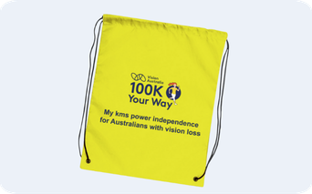 Yellow draw string bag with 100K Your Way logo on it