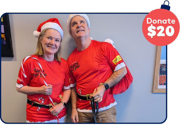 2 people where red Santa Fun Run event tshirts 2 people where red Santa Fun Run event tshirts