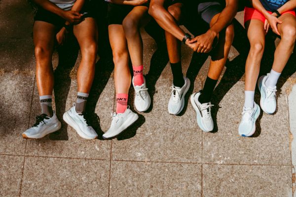 Bird's eye shot of people's legs wearing Brooks runners